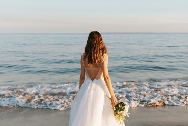 bride on beach tideline resort